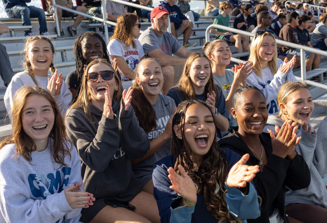 UMW students cheer from the stands at an Eagles athletic event.