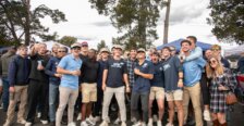 Families and friends wearing Mary Wash merchandise gather at the Homecoming Tailgate.