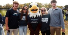 UMW students pose with Sammy D. Eagle, the university&rsquo;s mascot.