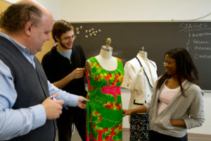 Fashion students designing dress