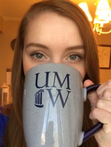 image of student with UMW mug