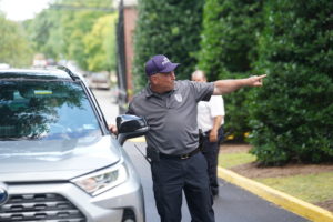 Chief Hall directs traffic during Move In Day