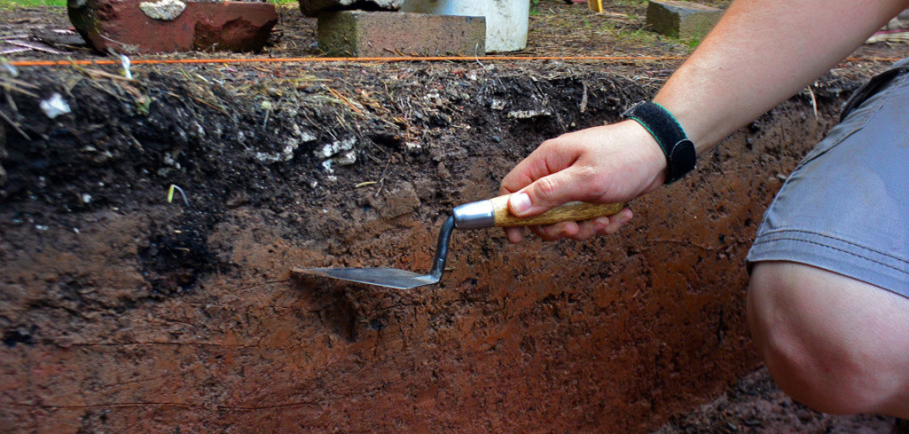 Hunkered down with trowels and dustpans, McMillan and her Field Methods in Archaeology students at the University of Mary Washington look like kids in a sandbox.