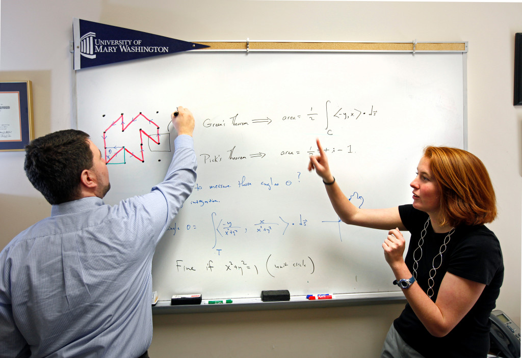 Math professor Randall Helmstutler is working with sophomore Claire Gianelle on a research project connecting multivariable calculus to a famous old theorem in geometry. This project is part of the university’s URES 197 program that focuses on research for students at any level. Monday Jan. 30, 2012. Posed situation. (Photo by Norm Shafer).