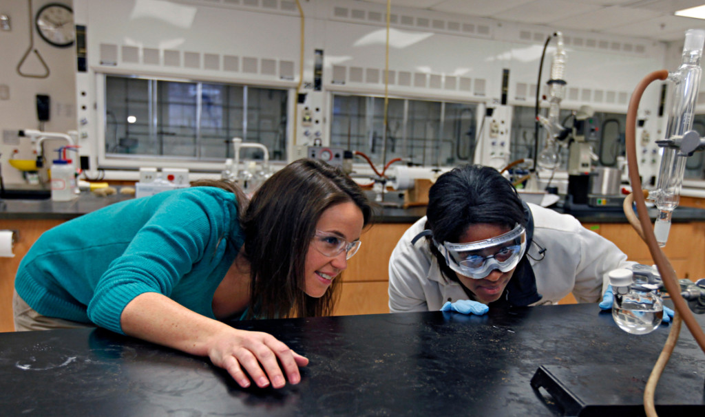 Nicole Crowder, assistant professor of chemistry works with students on a research project, Tues. Feb. 26, 2013 (Photo by Norm Shafer).
