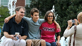 Family being photographed at Family Weekend